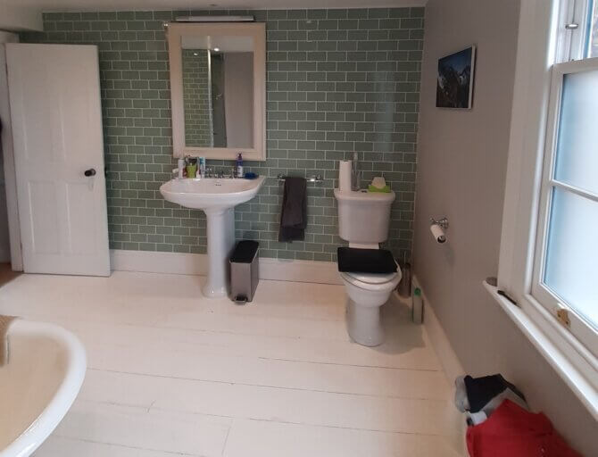 Before photo of space wasting bathroom design